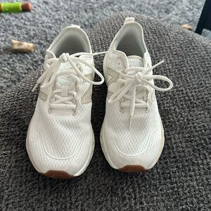 White and beige new balance shoes